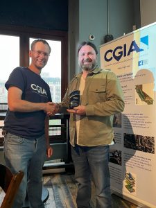 CGIA Awards 2025: Roland Martin presents the Student & Early Career Award to Daniel Collins.